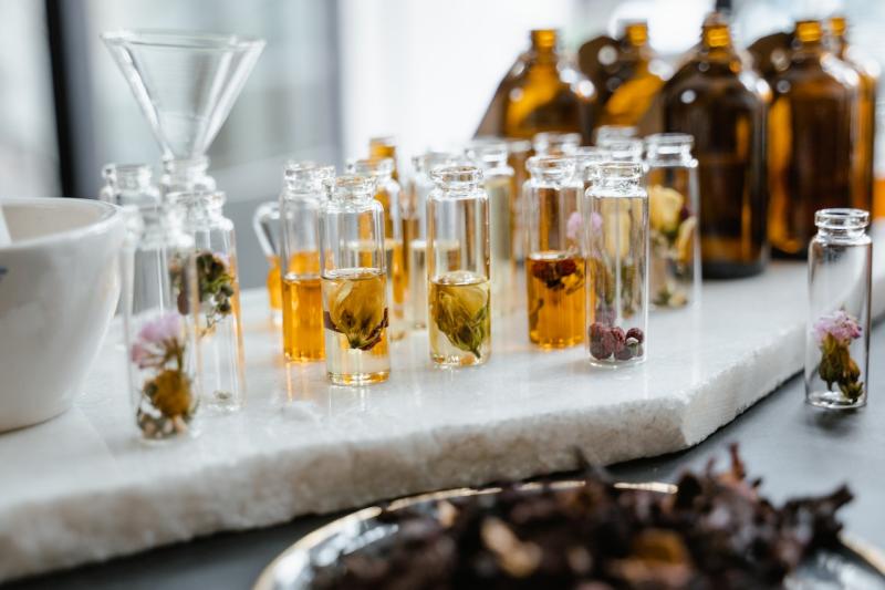 Several vials of aromatic compounds on a perfumer's table