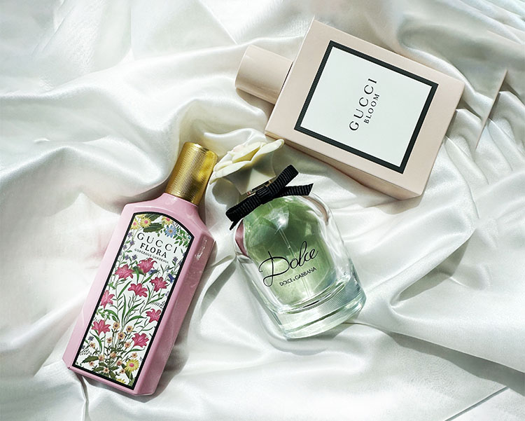 3 floral perfumes on a satin surface
